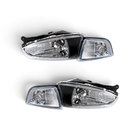 MITSUBISHI MIRAGE 1997-2001 COUPE FOCOS DELANTEROS FONDO NEGRO CON ESQUINEROS